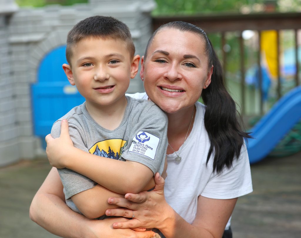 Xavier, a Safely Back Home program participant, with his mother Ashley.